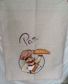 a chef holding a loaf of bread on top of a kitchen towel with the word ron written across it