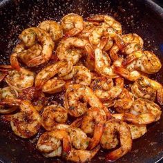 shrimp being cooked in a skillet on the stove