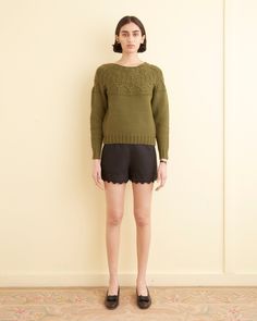 This sweater is inspired by one knit by Emily's grandmother in the 1960s. We reproduced the original sweater for this style, which has been hand-loomed. The crewneck is made of olive wool and features detailing around the neckline. 100% wool Made in Peru Dry-clean only View all knitwear Vanessa is 5'10” and wearing a s Victorian Quilts, New York Mens, Paloma Wool, Antique Fabrics, Nike Fashion, Hand Loom, Green Sweater, Cut Shirts, Trouser Pants