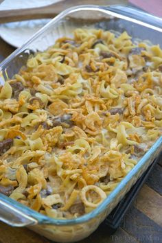 a casserole dish filled with pasta and meat