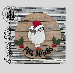 a wooden sign with a chicken wearing a santa hat