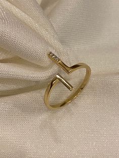 "ABOUT PRODUCT This 14K Gold T Bar Ring is beautifully designed and hand crafted with our associates to make this a special gift for your loved ones. Knowing the value of our customers, We prepare each piece with extra care and attention.  ITEM DETAILS Material: 14K Gold Approx:  1.60 gram Available colors: Gold, Rose Gold, White Gold Available Sizes: 4 US to 11 US  ✪ 14k Solid Gold ( Certification will be included with your order ) ✪Available 14K White, Yellow, Rose Gold (also in 10, 18K) 🛠 Ya Parallel Bar, Open Ring Gold, Cute Gifts For Her, Gold Rings Stackable, Zierlicher Ring, Stacked Necklaces, Bar Ring, Solid Gold Necklace, Rose Gold White