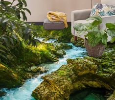 a living room scene with a river running through the center of the floor and plants on the other side