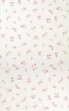 a white wall with pink flowers on it