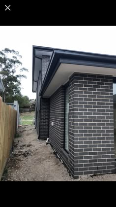 an image of a brick house being built