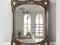 an ornate mirror with the words hello friends on it