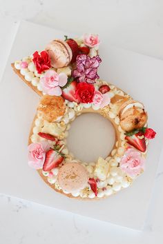 a doughnut decorated with flowers and shells