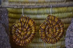 Pandanus earrings made by one of Injalak's wonderful weavers, Helen Nawirridj. These earrings use a combination of 100% local organic dyes, with subtle colour variation in the dyed Pandanus. We provide the sterling silver hooks to our weavers. In Aboriginal languages, necklaces, bracelets, earrings and other body adornments are usually named after the body part they are used for. A necklace is 'for the neck', and a bracelet is 'for the arm'. An earring is known as 'Kunkanemkenh', made up of 'kun Earthy Handwoven Jewelry For Gifts, Handmade Unique Wrap Earrings, Earthy Handmade Multicolor Earrings, Handmade Artisan Wrap Earrings For Gifts, Traditional Brown Drop Earrings, Traditional Brown Round Earrings, Brown Handwoven Earrings For Gift, Unique Brown Round Earrings, Handwoven Brown Bohemian Earrings