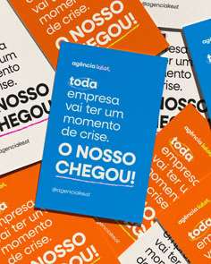 several different types of brochures are stacked on top of each other, one is blue and the other has orange