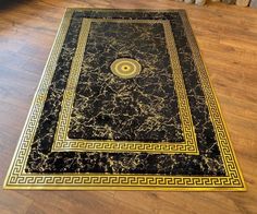 a black and gold area rug on the floor