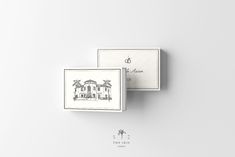 two business cards on top of each other with the logo for an estate in palm trees