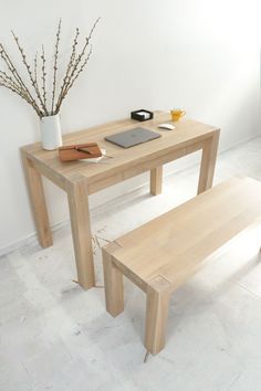 a wooden table with two benches next to it