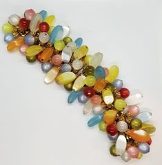 RARE Vintage NAPIER MOONGLOW BRACELET Lucite Dangles Beads Signed COLORS GALORE! | eBay Elegant Multicolor Large Beads Gems And Cabochons, Beading Inspiration, Moon Glow, Matching Earrings, Charm Jewelry, Round Beads, Beading, Gold Tones, Bangles