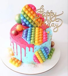 a birthday cake decorated with colorful icing and candies