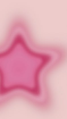 a blurry image of a pink star