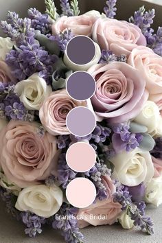 a bridal bouquet with roses and lavenders in shades of pink, purple and white