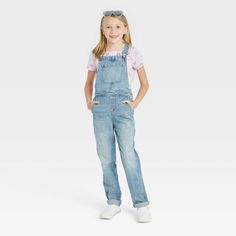 Add a cool finishing touch to your kid's wardrobe with these Overalls from Cat & Jack™. The denim overalls are made with soft and stretchy fabric in an ankle length cut for all-day comfort. Cut in a straight fit, the overalls feature an adjustable waistband for a comfy fit. Multiple pockets provide ample space to stash coins and other small items. The ankle-length overalls can be mixed and matched with her favorite tees for a quick and easy casual outfit. Cat & Jack™: Classics with an imaginatio Cute Overalls, Simple Casual Outfits, Girls Overalls, Black Overalls, Kids Wardrobe, Girls Denim, Adjustable Waistband, Hem Style, Denim Overalls