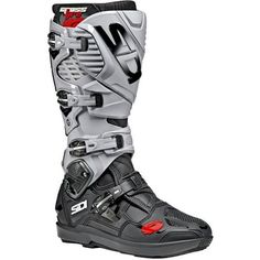 a pair of black and grey boots with red accents