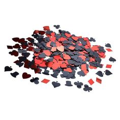 red and black confetti hearts are scattered on a white surface, as if for valentine's day