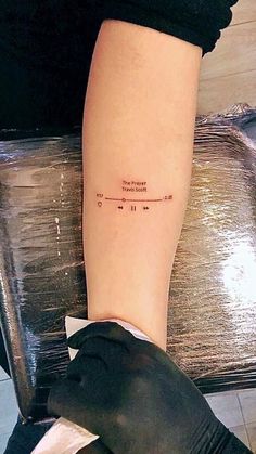 a woman's arm with a tattoo on it that reads, i love you