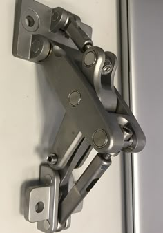 a close up of a metal door hinge