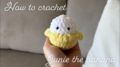 a hand holding a tiny crocheted toy with the words how to crochet june the banana