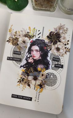 a book with an image of a woman surrounded by flowers and leaves on top of it