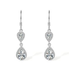 PRICES MAY VARY. Add some vintage drama with these double drop filigree earrings sparkling with exquisite cubic zirconia diamonds. Crafted to allow light to enter each stone for magnificent brilliance. Delicately linked, they sway and sparkle with every move. The timeless allure of the earring is enhanced by the brilliance of the crystal diamond and the sterling silver for a feminine piece that you can wear with your favorite outfit anytime at all. Simple yet classic, these teardrop earrings wil Simple Silver Earrings, Classic Earrings, Filigree Earrings, White Crystals, Crystal Diamond, Sparkle Earrings, Silver Earrings Dangle, Diamond Crystal, Teardrop Earrings