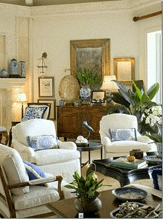 a living room with white furniture and blue accents on the walls is featured in an instagram