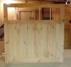 an unfinished room with wood paneling in it