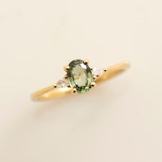 Green Sapphire Engagement Ring, 14K / 18k Yellow Gold, Light Green Sapphire, Greenish Sapphire Ring, Olive Sapphire, Teal Sapphire Ring - Etsy UK Oval Engagement Ring Gemstone, Oval Green Sapphire Engagement Ring, Light Green Stone Ring, Gold Wedding Rings Colored Stone, Green Gold Rings, Olive Green Engagement Ring, Oval Green Engagement Ring, Gold Green Engagement Ring