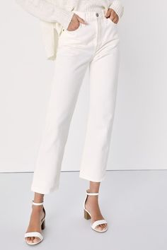 We just can't get enough of the Levi's Wedgie Straight White High-Rise Cropped Jeans! Sturdy denim (in Levi's In the Cloud's wash) forms these incredibly cute and on-trend jeans with a five-pocket cut, belt loops, and high-waisted fit. Branded top button and hidden button fly top straight pant legs with cropped hems. Red logo tag and leather patch at back. Fit: This garment fits true to size. Length: Ankle length. Size 28 Inseam: 27.00 Front Rise: 10.00 Waist: Fitted - very fitted at natural wai Chic White Jeans With Straight Hem, Chic White Straight Hem Jeans, Classic White Cropped Jeans, Classic White Cropped Leg Jeans, White Cropped Leg Jeans For Fall, Classic White Jeans For Work, Elegant Spring Jeans With Straight Hem, Elegant Straight Hem Jeans For Spring, White Relaxed Fit Cropped Jeans With Tapered Leg