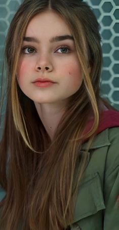 a young woman with long hair and blue eyes