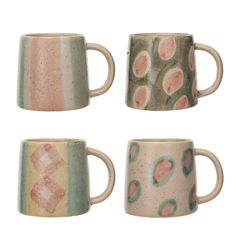 four coffee mugs with designs on them are shown in three different colors and shapes