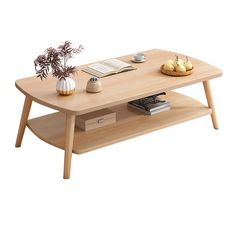 a coffee table with an open book and some fruit on the shelf next to it