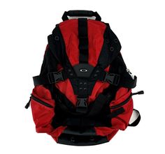 a red and black backpack sitting on top of a white floor