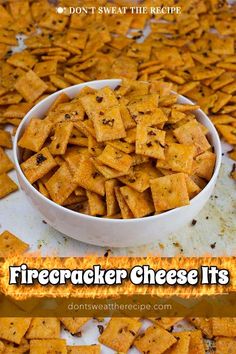 a white bowl filled with firecracker cheese is sitting on top of a table