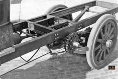 black and white photograph of an old fashioned wagon with gears attached to it's wheels