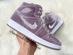 Bling Air Jordan 1 Mid Shoes Hand Customized with Genuine Swarovski Crystals Colors: Purple Velvet w/ White Soles Model and Color Code: #DQ8397-500 Note: Box may be missing top lid or shoe box Each and every Swarovski crystal is set by hand with top quality, permanent adhesive. Our products come direct from the manufacturer or authorized retailers, and are 100% authentic. We offer free crystal replacement for life! Should any crystals fall off, simply send your shoes back to us and we'll fix them for only the cost of shipping! Here are some other options you might like: https://etsy.me/2O6KIZp https://etsy.me/33Hy21z https://etsy.me/34XSbAN https://etsy.me/2pjfnug Rosa Jordans, Pinterest Room, Pink Jordans, Ball Shoes, Pretty Sneakers, Mid Shoes, Velvet Sneakers, Custom Bling, Nike Air Jordan 1 Mid