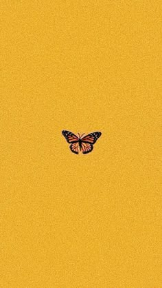 a butterfly flying in the sky with yellow background