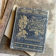 an old book sitting on top of a wooden table