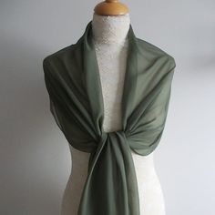 This olive green chiffon wrap/shawl would be perfect for bridesmaids, prom, wedding guest or going to the races. It has a soft draping quality. It has a roll edge finish. Dimensions 78" x 18"                        200 cm x 46 cm Gentle wash,    do not tumble dry Green Bolero, Wedding Shrug, Knit Shrug, Chiffon Wrap, Wedding Shawl, Wedding Wraps, Bridal Sash, Wrap Shawl, Dark Olive Green