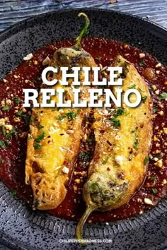 grilled fish with red sauce and herbs on top in a black plate that says chile relleno