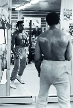 a man standing in front of a mirror