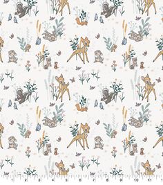 a white fabric with animals and plants on it