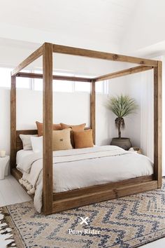 a bedroom with a bed, rugs and pillows on the floor in front of a sliding glass door