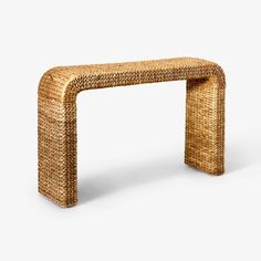 a wicker bench made out of woven material