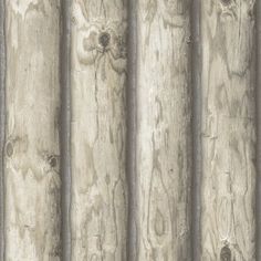 an old wooden wall with peeling paint and lines on the wood paneling, as if it were painted in gray or white