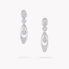 An alluring display of diamond mastery, our high jewellery earrings in white gold focus the eye on the abstract beauty of the signature motif in the Tribal collection. Defined by their dramatic curves, clusters of pavé diamonds guide the eye to the sculptural Graff Gateway: an exquisite pavé diamond oval embracing a timeless pear shape diamond.    United by a striking array of signature silhouettes, the Tribal collection draws from the diamond’s inherent beauty. Expertly crafted for everyday ele Graff Jewelry, Diamond Shaped Engagement Ring, Abstract Beauty, Pave Diamond Earrings, Diamond Earrings Studs Round, High Jewellery, Mini Earrings, Engagement Ring Shapes, Bridal Engagement Rings