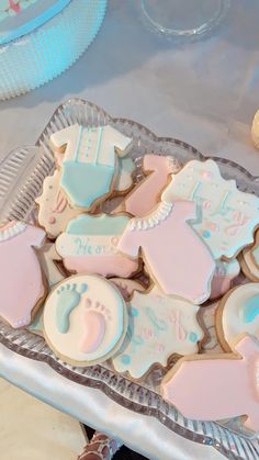 baby shower cookies are on a platter